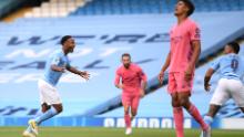 Raheem Sterling celebrates after scoring Manchester City's first goal.