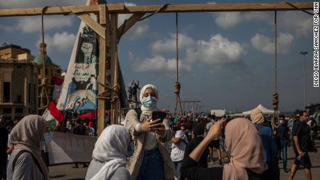 Dana Itani takes a selfie in Martyr Square. &quot;These politicians deserve to be hanged here,&quot; Itani said.