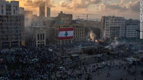 A general view shows thousands of protesters facing riot police in Beirut.