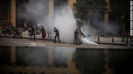 Protesters defy riot police in front of Le Gray Hotel in downtown Beirut.