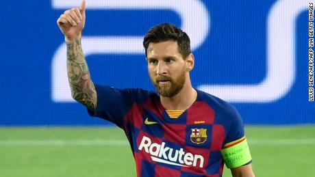 Lionel Messi celebrates after scoring Barcelona&#39;s brilliant second goal against Napoli in the Champions League last 16 second round tie in the Camp Nou.