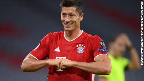 Robert Lewandowski celebrates after scoring his 52nd goal of the season to put his side Bayern Munich ahead from the penalty spot during the Champions League round of 16 second leg match against Chelsea.