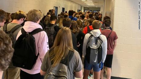 CORRECTS SPELLING OF LAST NAME TO WATTERS, NOT WATERS - FILE - In this photo posted on Twitter, students crowd a hallway, Tuesday, Aug. 4, 2020, at North Paulding High School in Dallas, Ga. The Georgia high school student says she has been suspended for five days because of photos of crowded conditions that she provided to The Associated Press and other news organizations. Hannah Watters, a 15-year-old sophomore at North Paulding High School, says she and her family view the suspension as overly harsh and are appealing it. (Twitter via AP, File)