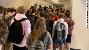 A school nurse in the district with the crowded hallway photo quit over a scarcity of Covid-19 precautions. Rising cases are 'not the validation' she wanted