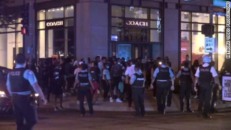 Chicago police arrest more than 100 people after shootout and looting downtown