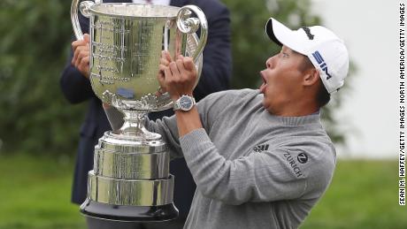 SAN FRANCISCO, CALIFORNIA - AUGUST 09: Collin Morikawa of the United States reacts as the lid to the Wanamaker Trophy falls off during the trophy presentation after the final round of the 2020 PGA Championship at TPC Harding Park on August 09, 2020 in San Francisco, California. (Photo by Sean M. Haffey/Getty Images)