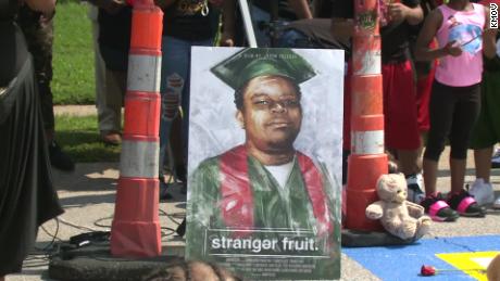 Protesters gather outside Ferguson Police Department on anniversary of Michael Brown's death