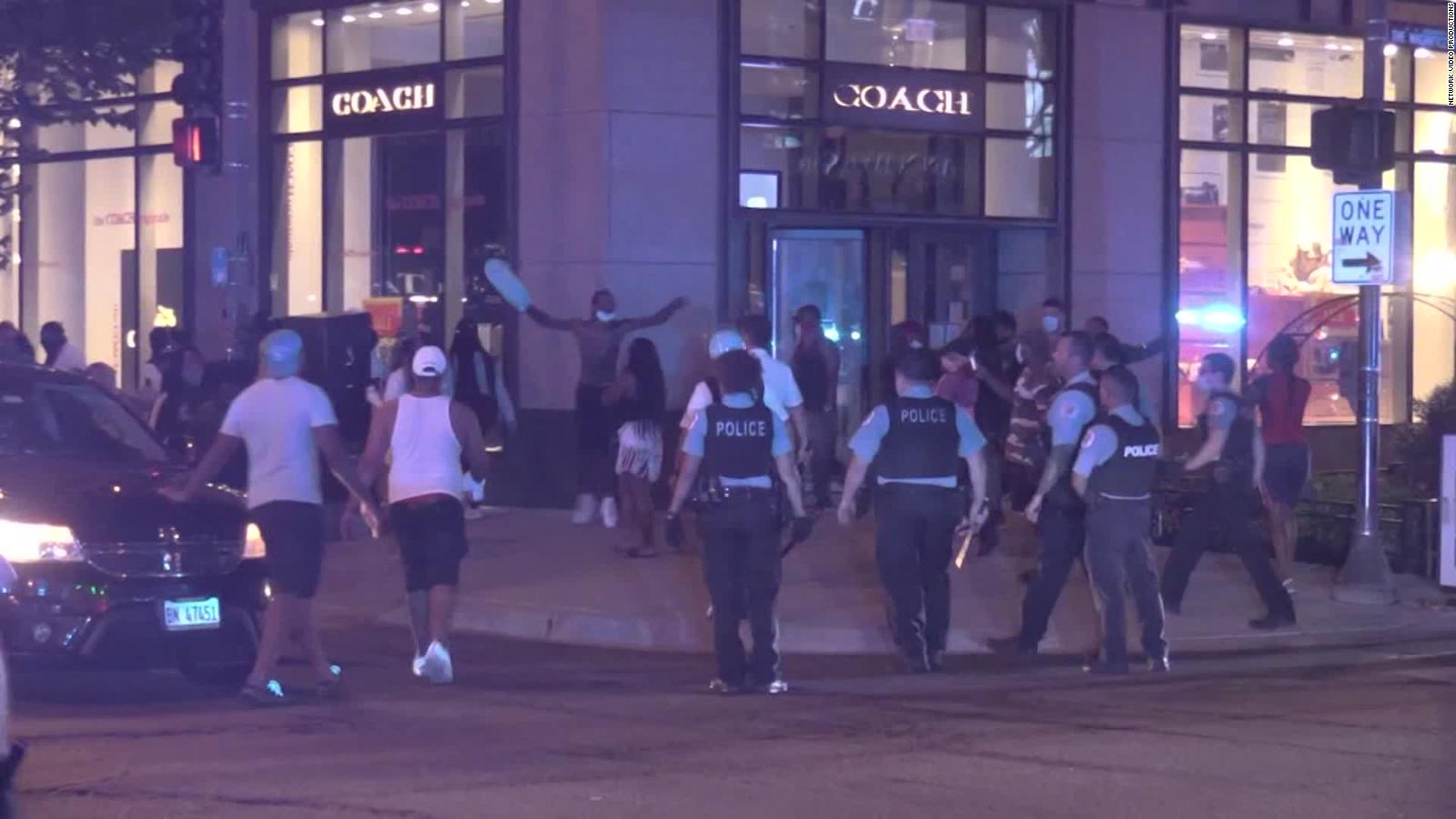 Chicago police arrest more than 100 people after shootout and looting