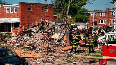 Firefighters at the scene of where homes were destroyed.