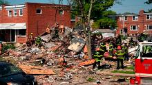 Firefighters at the scene of where homes were destroyed.