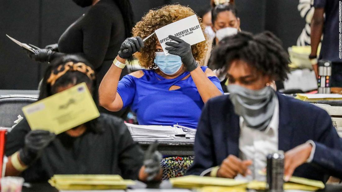 Election officials sort absentee ballots in Atlanta, where there were several runoffs taking place on August 11.