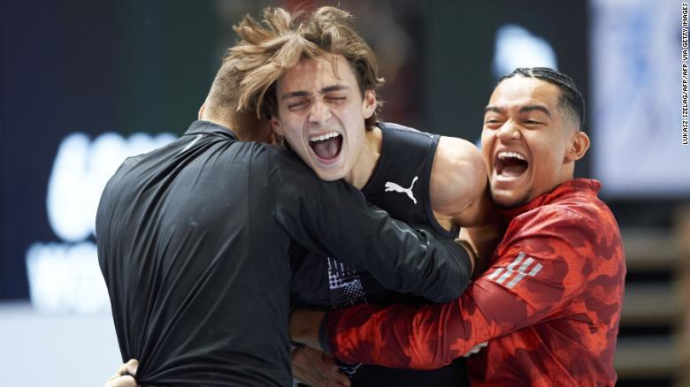 Duplantis (center) celebrates after setting the world record in Torun, Poland, this February.