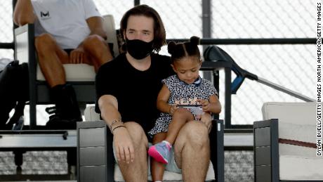 Alexis Ohanian and Olympia look on during Tuesday&#39;s match. 