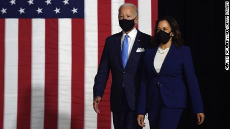 Joe Biden and Kamala Harris arrive at their first joint press conference on Wednesday wearing masks.