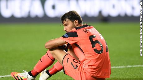 Atalanta goalkeeper Marco Sportiello slumps to the ground after the game. 