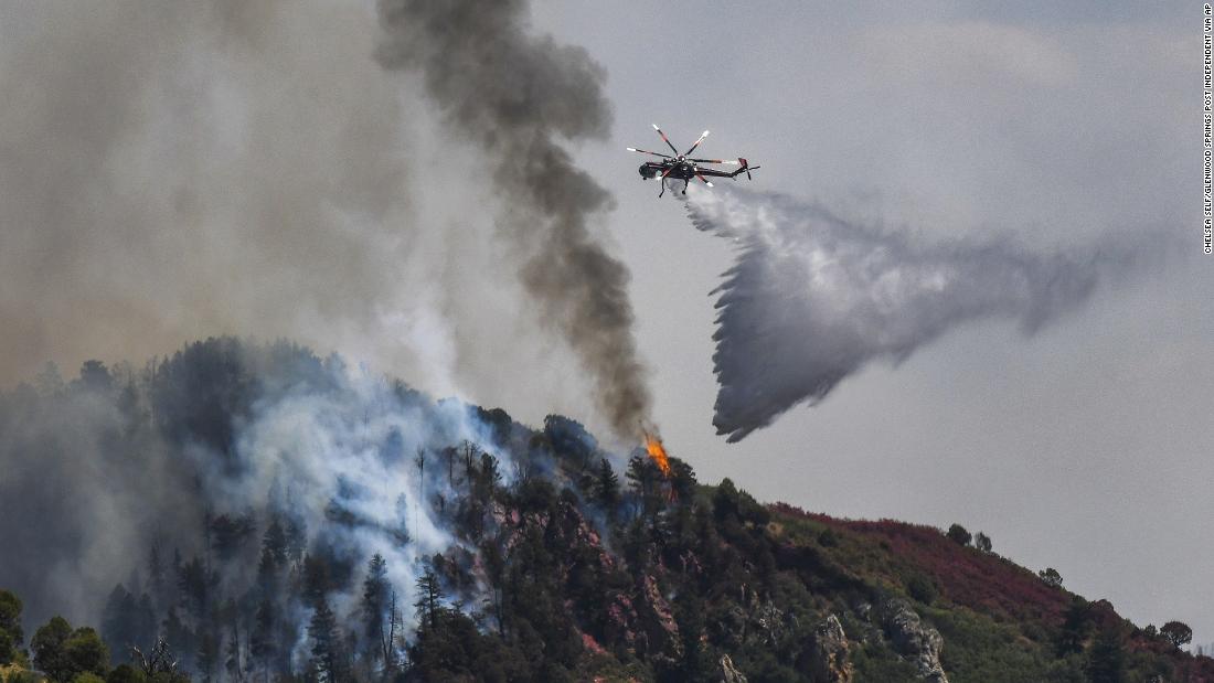 Fire crews battle the Grizzly Creek Fire near Glenwood Springs, Colorado, on August 11, 2020.