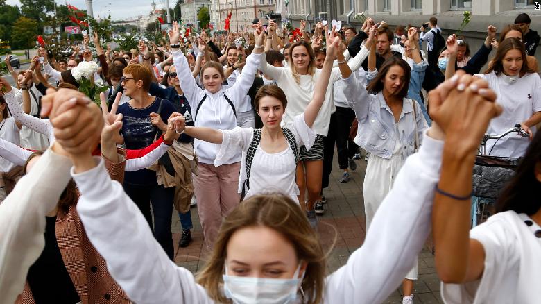 About 200 women march in solidarity with protesters injured in the latest rallies against the results of the country's presidential election in Minsk, Belarus, Wednesday, Aug. 12, 2020.