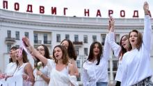 Women dressed in white protest against police violence during recent rallies against the election results, which many say were rigged.