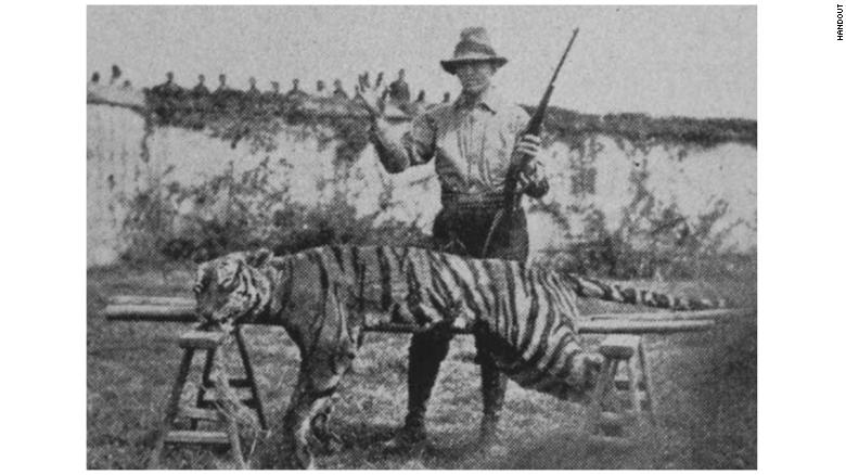 Methodist minister Harry Caldwell, with a tiger he killed in Fujian. He wrote of the animal: &quot;I shot the animal with a .22-caliber high-power Savage rifle at close range, after the animal had charged me from a long distance. This is a bit of real missionary work I have greatly enjoyed, and incidentally have found most helpful in the preaching of the gospel.