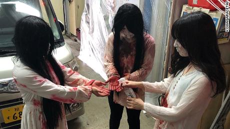 The haunted house drive-in is located in a covered parking garage in downtown Tokyo.