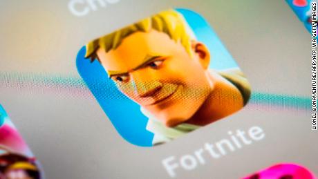 This illustration picture shows the video game Fortnite app logo displayed by a tablet in Paris, on February 18, 2019. (Photo by Lionel BONAVENTURE / AFP)        (Photo credit should read LIONEL BONAVENTURE/AFP via Getty Images)