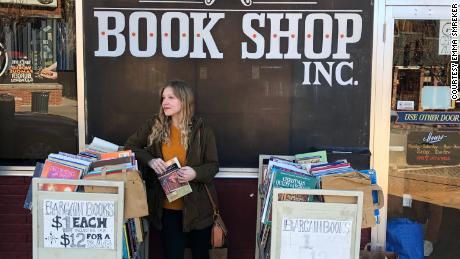 High school teacher Emma Smreker stands outside a used bookstore in Fayetteville, Arkansas. 
