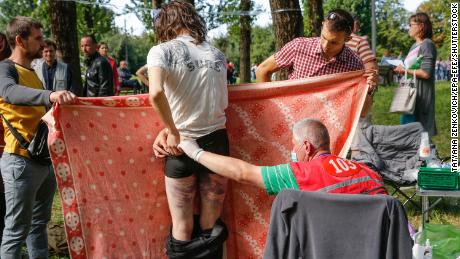 Doctors provide medical treatment to people after they were released from a detention center in Minsk, Belarus, on Friday.