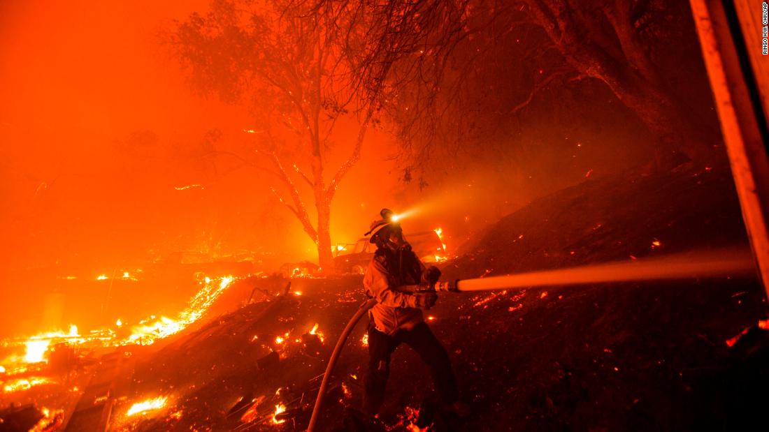 A firefighter works against the Lake Fire on August 12.