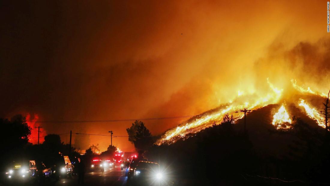 Flames and smoke from the Lake Fire rise on Wednesday, August 12, 2020.