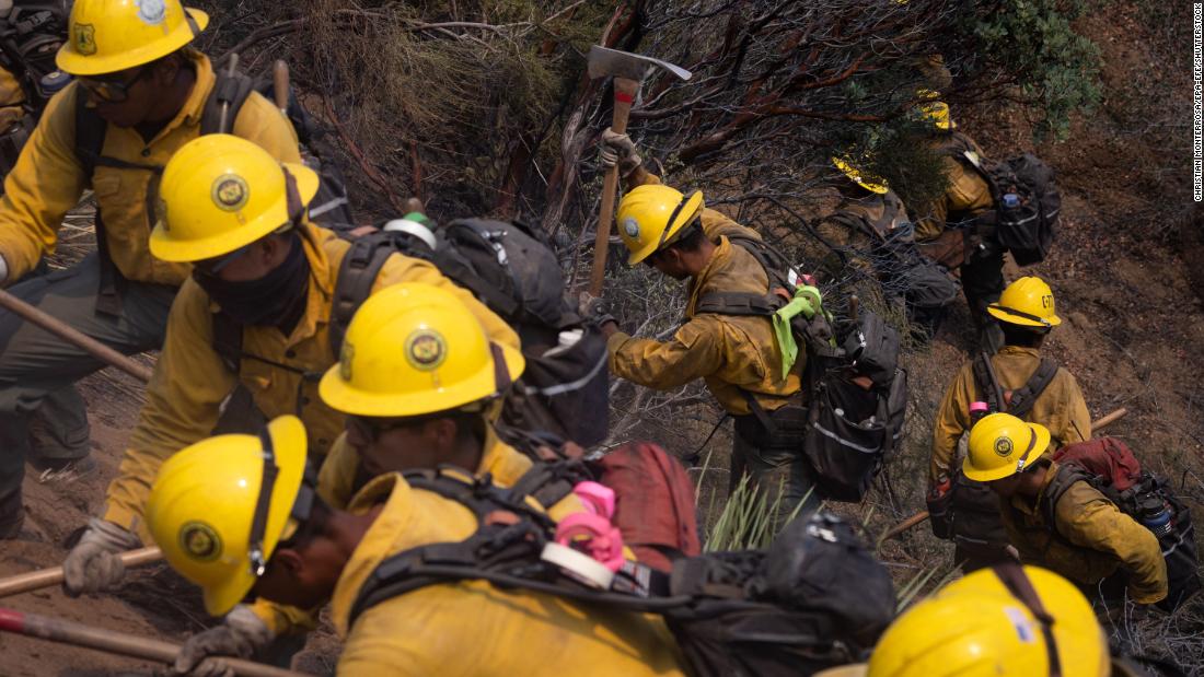 A firefighter crew works in Lake Hughes on August 13, 2020.