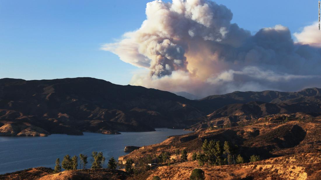 A plume of smoke rises from the Lake Fire on August 12.