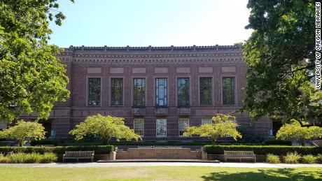 The University of Oregon is covering racist murals in its library, one of which references the need to conserve 'our racial heritage'