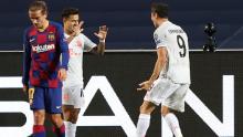 Lewandowski (right) celebrates with Coutinho after he scored. 