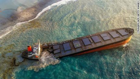 A cargo ship leaking tons of oil off the Mauritius coast has split in two