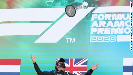 Hamilton celebrates on the podium after winning the Spanish  Grand Prix.