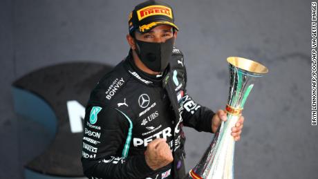 Mercedes&#39; British driver Lewis Hamilton celebrates on the podium after the Spanish Formula One Grand Prix at the Circuit de Catalunya in Montmelo near Barcelona, on August 16, 2020. (Photo by Bryn Lennon / POOL / AFP) (Photo by BRYN LENNON/POOL/AFP via Getty Images)