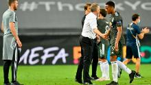 Solskjaer (second right) consoles Anthony Martial (right) after defeat to Sevilla.