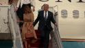 Melania appears to turn away from President Trump's offered hand