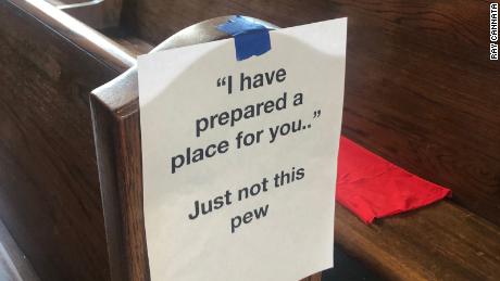 Ray Cannata, pastor of Redeemer Presbyterian Church in New Orleans, printed and taped hundreds of signs encouraging churchgoers to sit apart by referencing Bible scriptures with a funny twist.