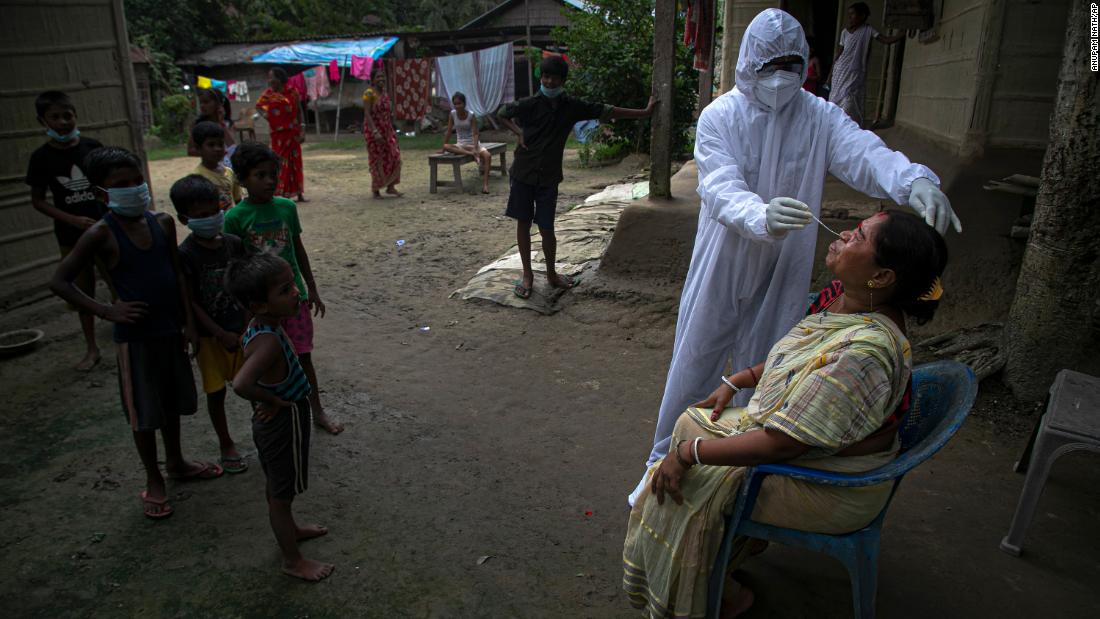 A health worker administers a Covid-19 test in the Indian village of Kusumpur on August 17.