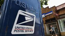 Postal Service backs down on changes as at least 20 states sue over potential mail delays ahead of election