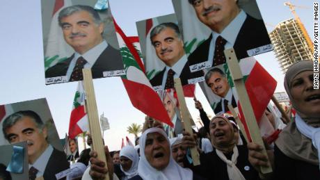 Lebanese women holding posters of Hariri march in Beirut in March 2005. 