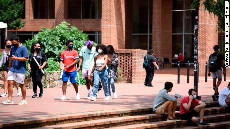 Students walk through the campus of the University of North Carolina at Chapel Hill in August. The university canceled classes after clusters of coronavirus cases appeared.