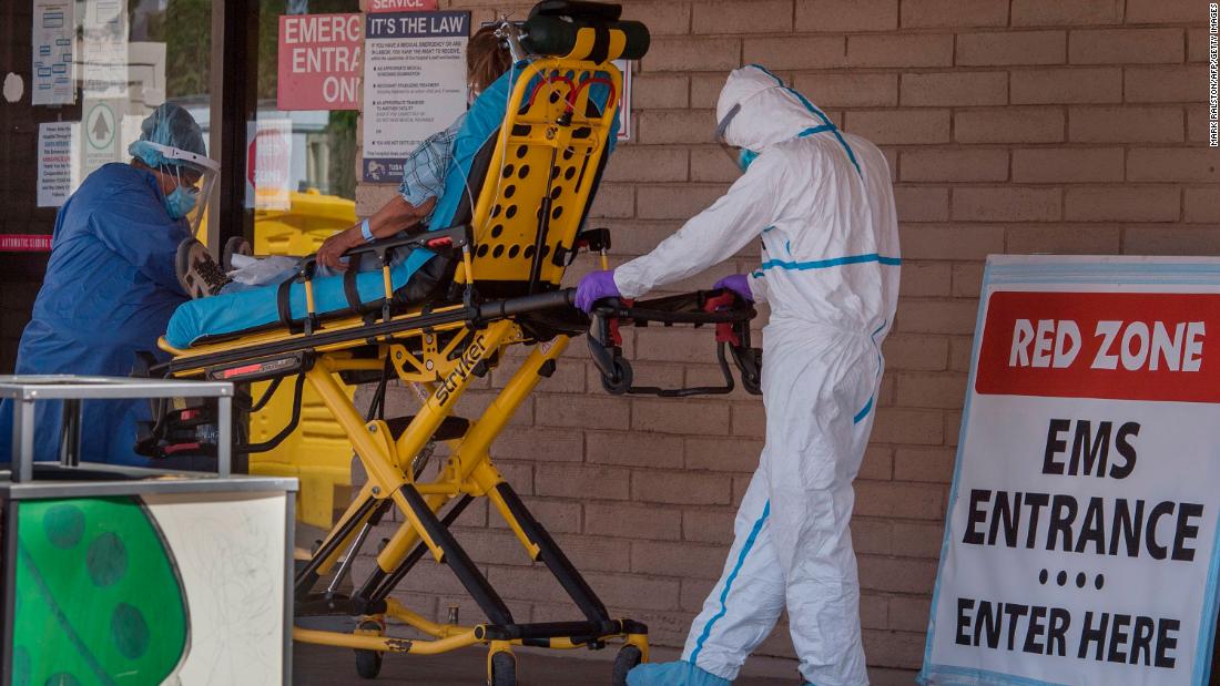 A patient is taken from an ambulance to the emergency room of a hospital in the Navajo Nation town of Tuba City, Arizona, on May 24, 2020.