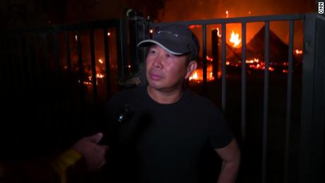 Thuy Ngo stands in front of his burning barn Wednesday near Vacaville.