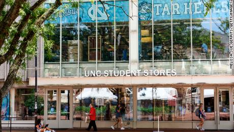 Students walk through the campus of the University of North Carolina at Chapel Hill on August 18. 