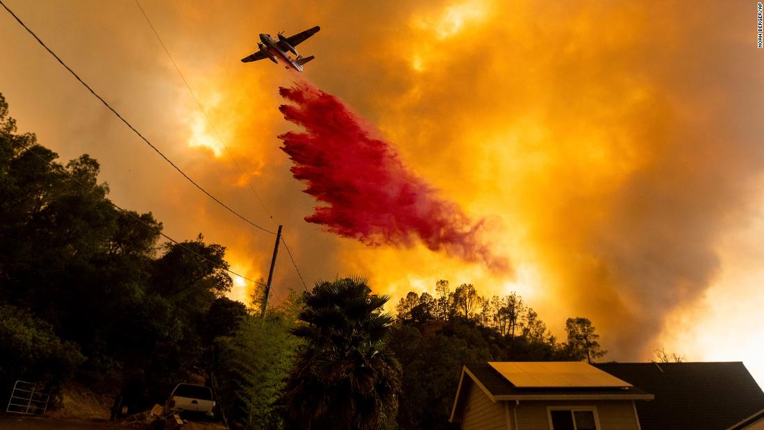 An air tanker drops retardant on fires in the Spanish Flat community of Napa County on August 18.
