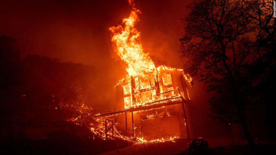 A home burns as the LNU Lightning Complex fires tear through the Spanish Flat community in Napa County on August 18.