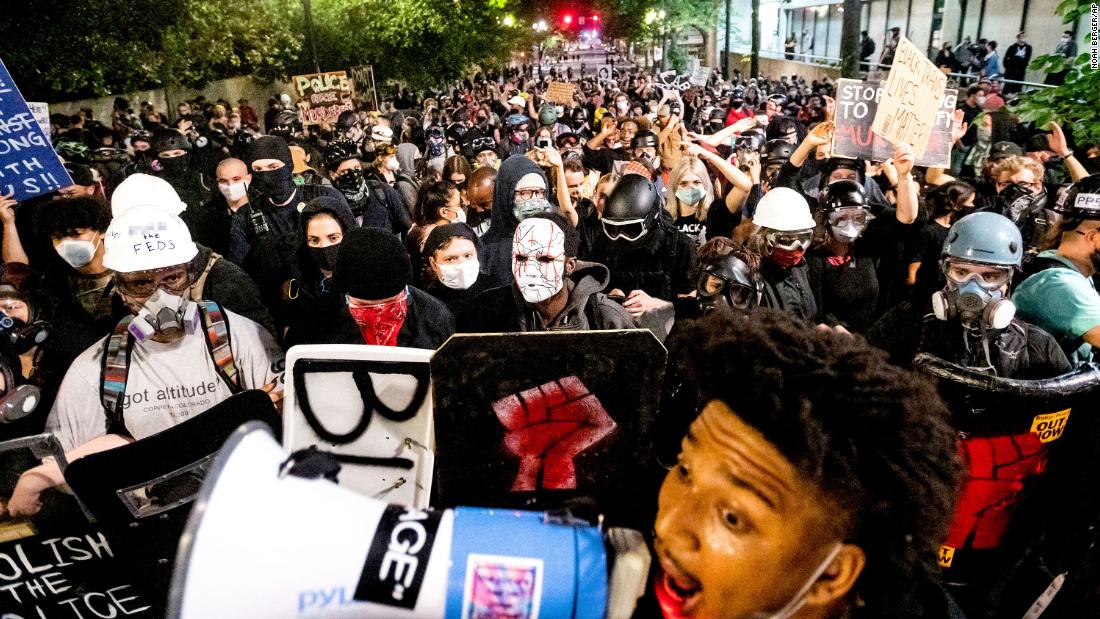 Protesters march through the streets after rallying at the Mark O. Hatfield United States Courthouse on August 2. &lt;em&gt;(Editor&#39;s note: Part of this photo has been blurred because of profanity.)&lt;/em&gt;