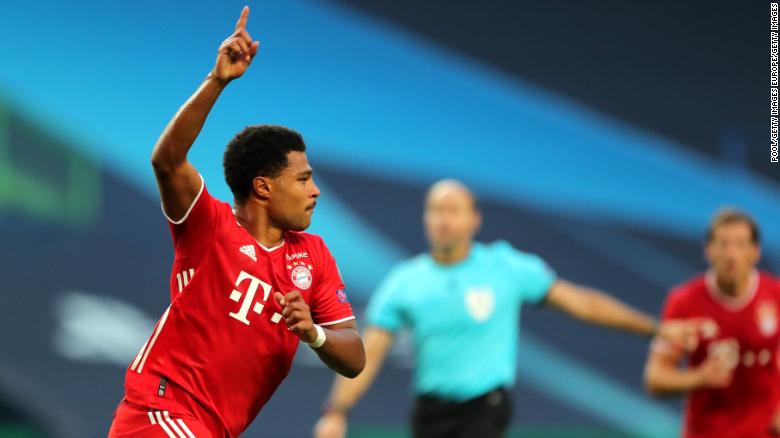 Serge Gnabry celebrates scoring the opening goal against Lyon.